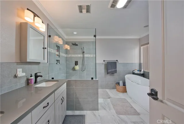 a bathroom with a granite countertop sink mirror and double