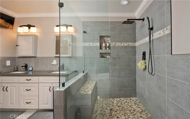 a bathroom with a bathtub and shower