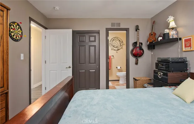 a bathroom with a toilet a sink and a mirror