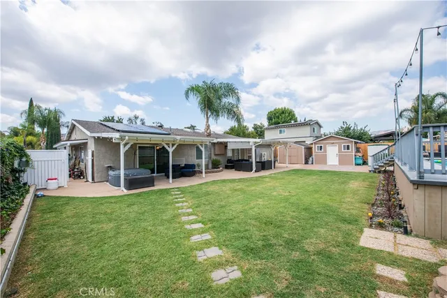 a balcony with tall trees