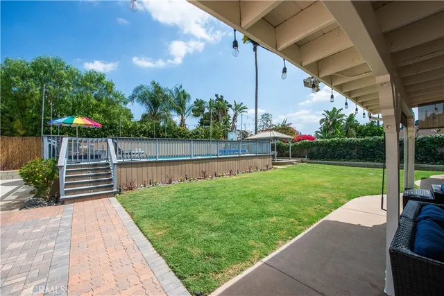 a view of a garden with a car park