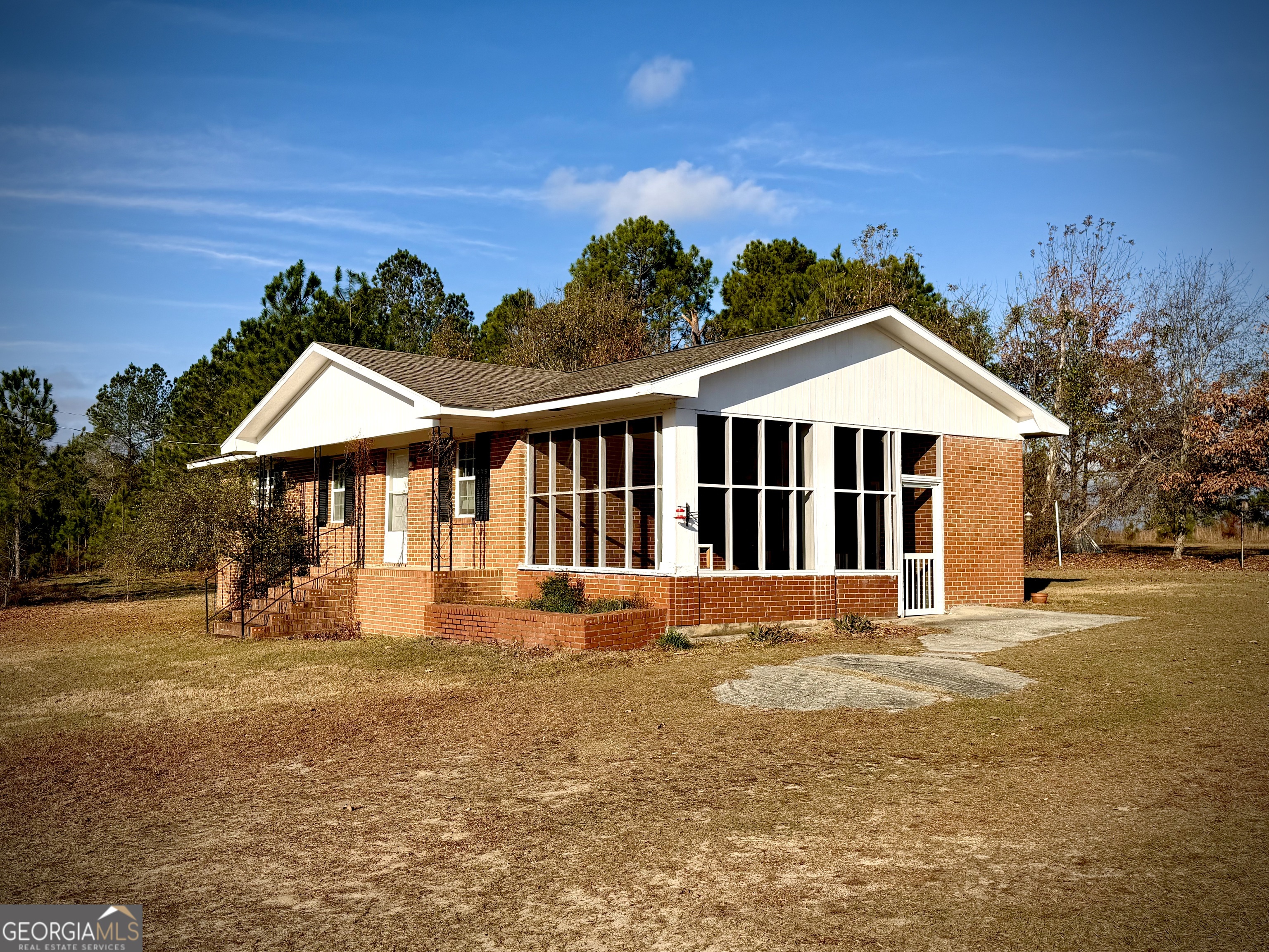 984 Bush Road East Dublin, GA 31027 - Photo 1 of 1 a view of a house with a yard