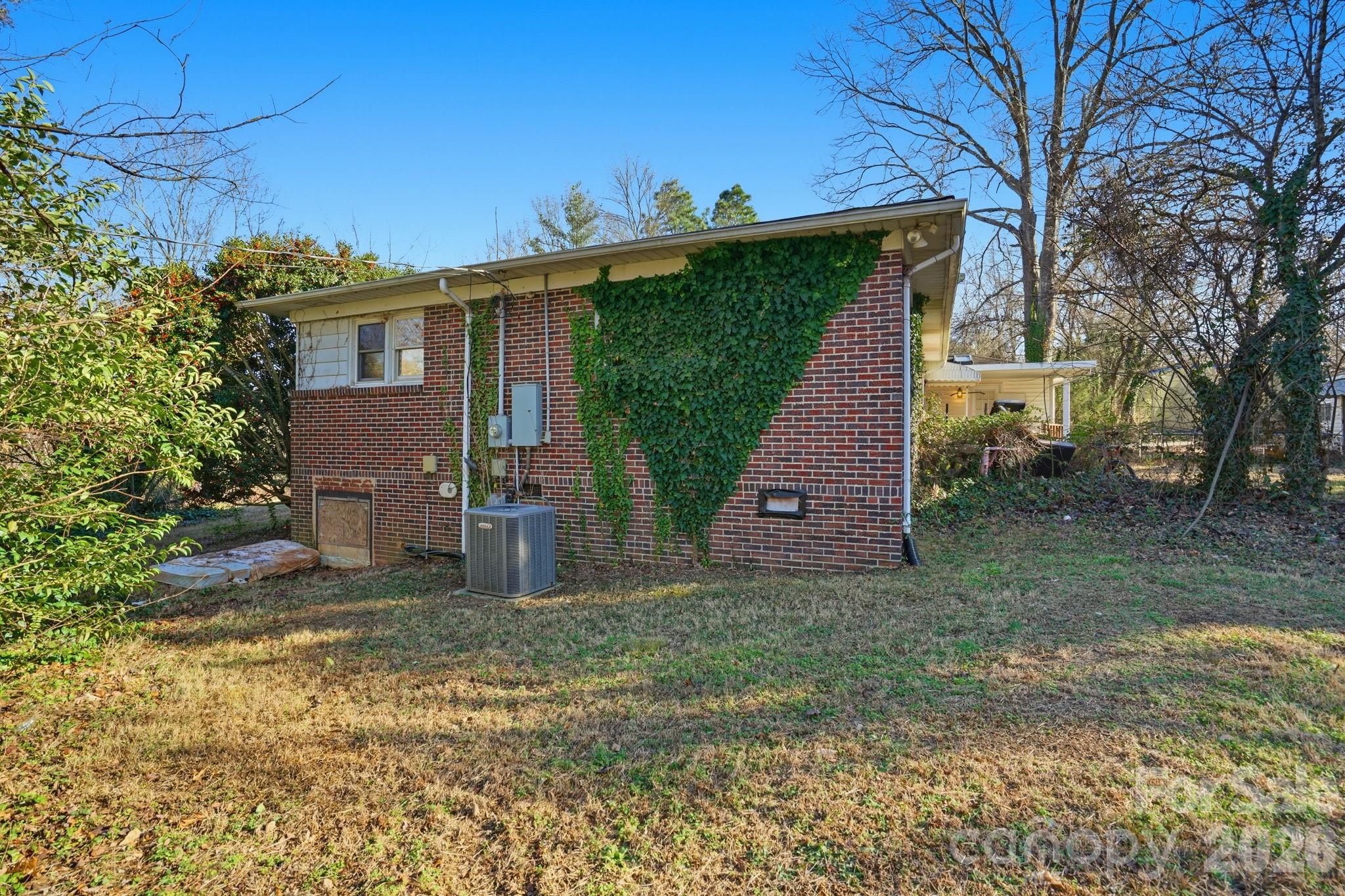 106 Fielding Road Charlotte, NC 28214 - Photo 3 of 10 a view of a house with a yard