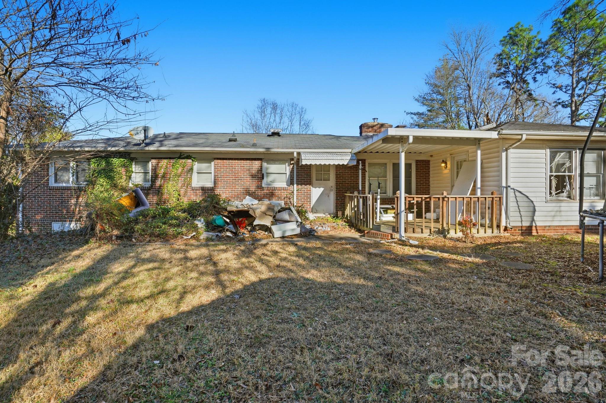 106 Fielding Road Charlotte, NC 28214 - Photo 6 of 10 front view of a house with a patio