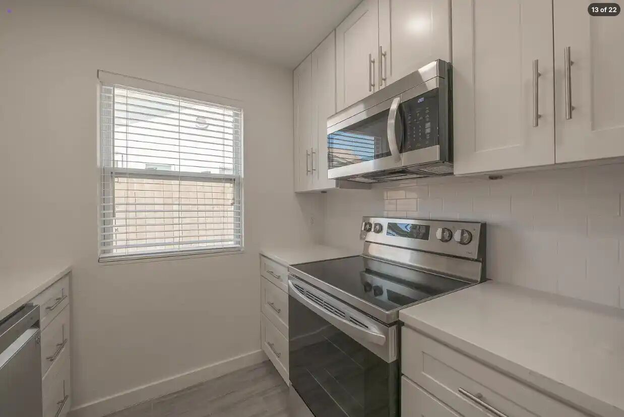 303 Fantail Loop, Unit B Austin, TX 78734 - Photo 3 of 11 Streamlined cabinetry and sleek countertops frame a modern, efficient culinary space.