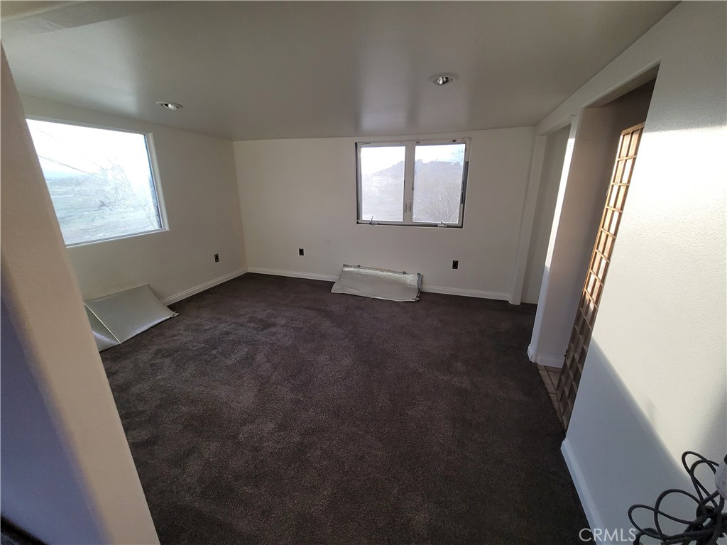 195 Old El Mirage Road Adelanto, CA 92301 - Photo 23 of 37 a view of an empty room and a window