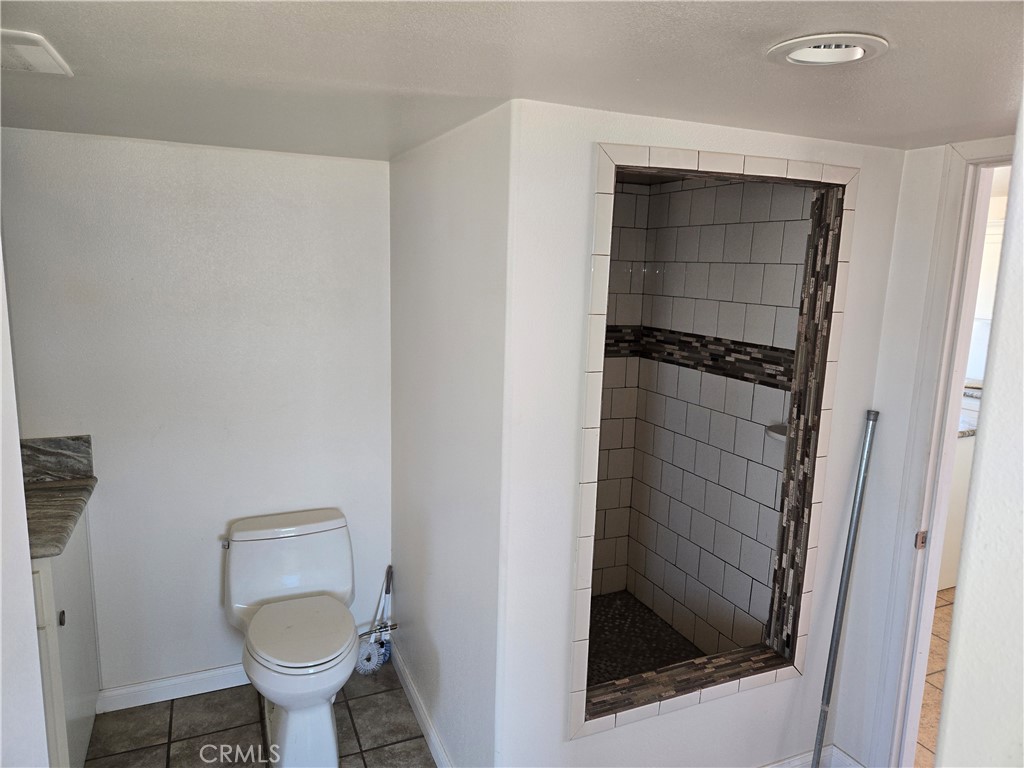 195 Old El Mirage Road Adelanto, CA 92301 - Photo 25 of 37 a bathroom with a toilet and a sink