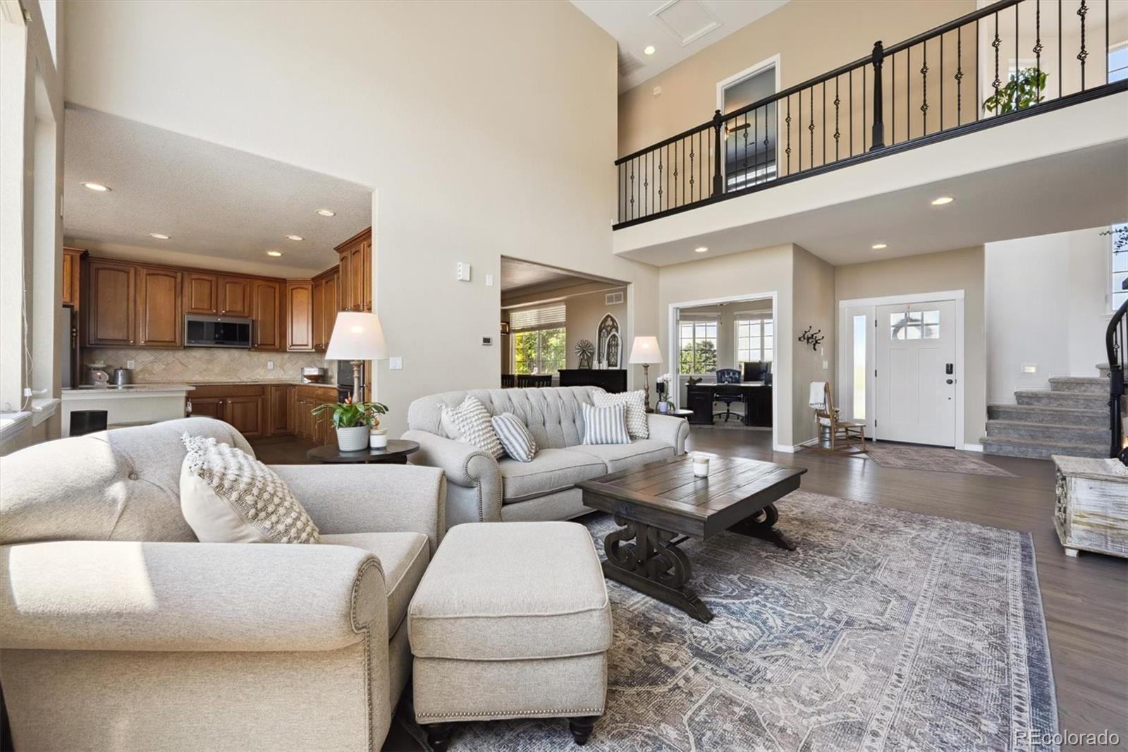 724 Imboden Road Watkins, CO 80137 - Photo 7 of 50 a living room with furniture kitchen view and a dining table view