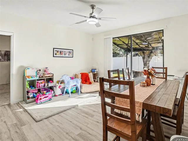 a view of a dining room with furniture and a table