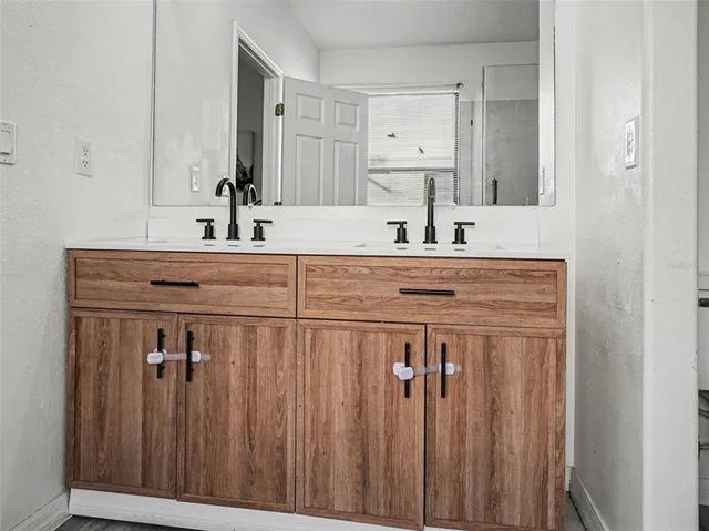 a view of a sink and a mirror