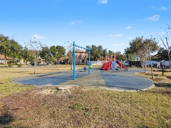 a view of a park with swings and slides