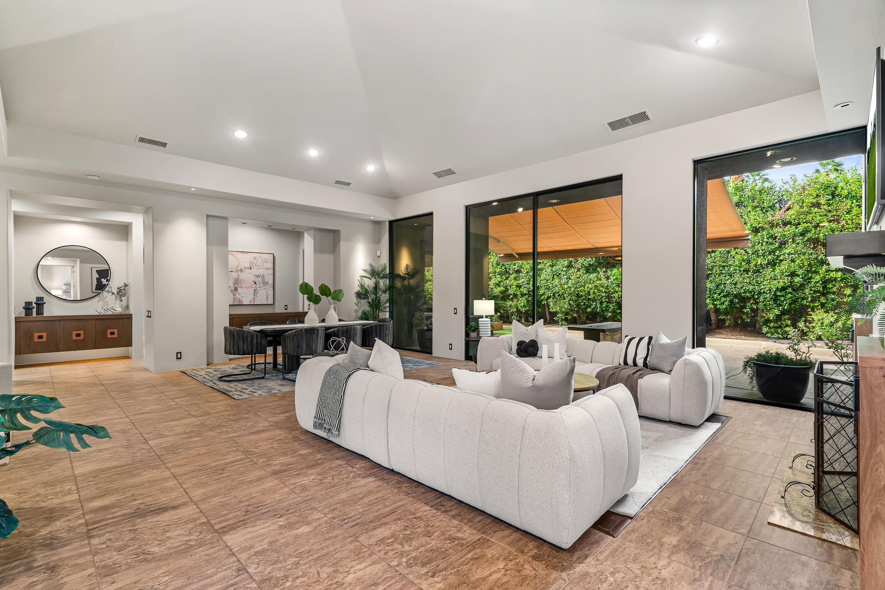 79200 Jack Rabbit Trail La Quinta, CA 92253 - Photo 21 of 76 a living room with furniture and large windows
