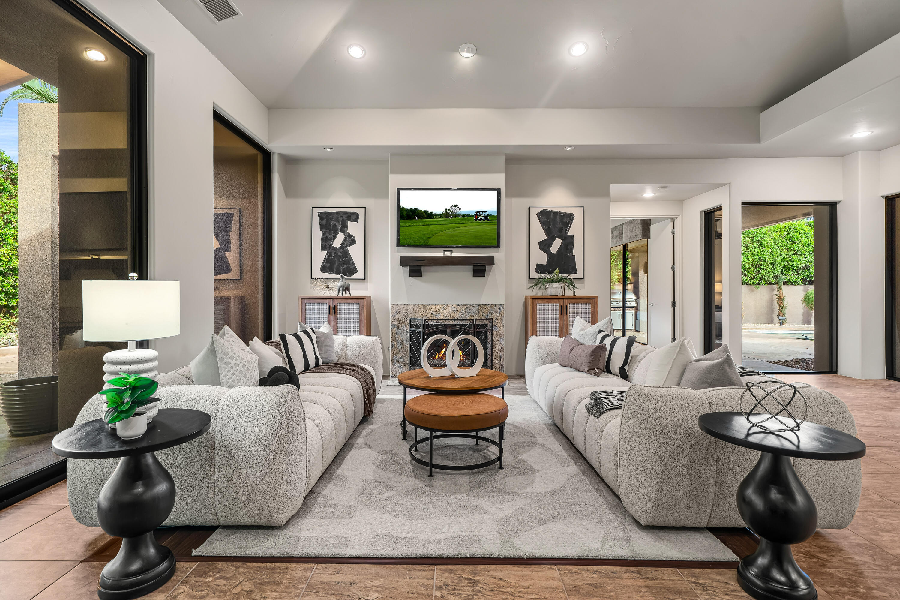 79200 Jack Rabbit Trail La Quinta, CA 92253 - Photo 23 of 76 a living room with furniture a fireplace and a flat screen tv
