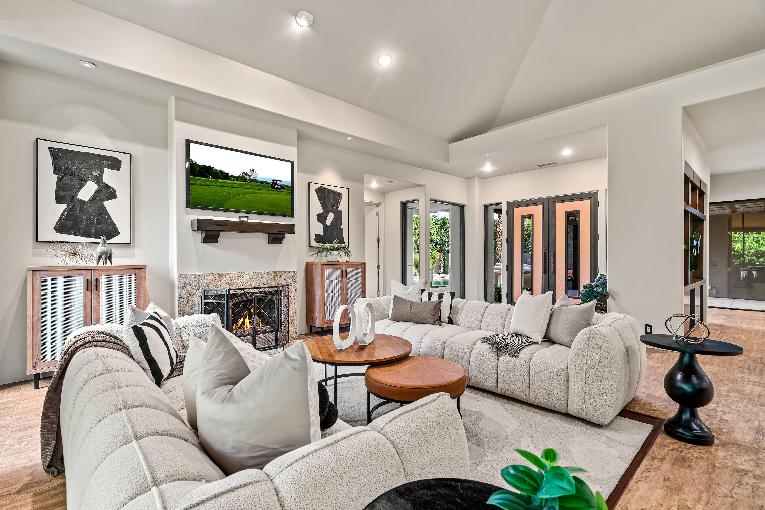 79200 Jack Rabbit Trail La Quinta, CA 92253 - Photo 25 of 76 a living room with furniture fireplace and a flat screen tv