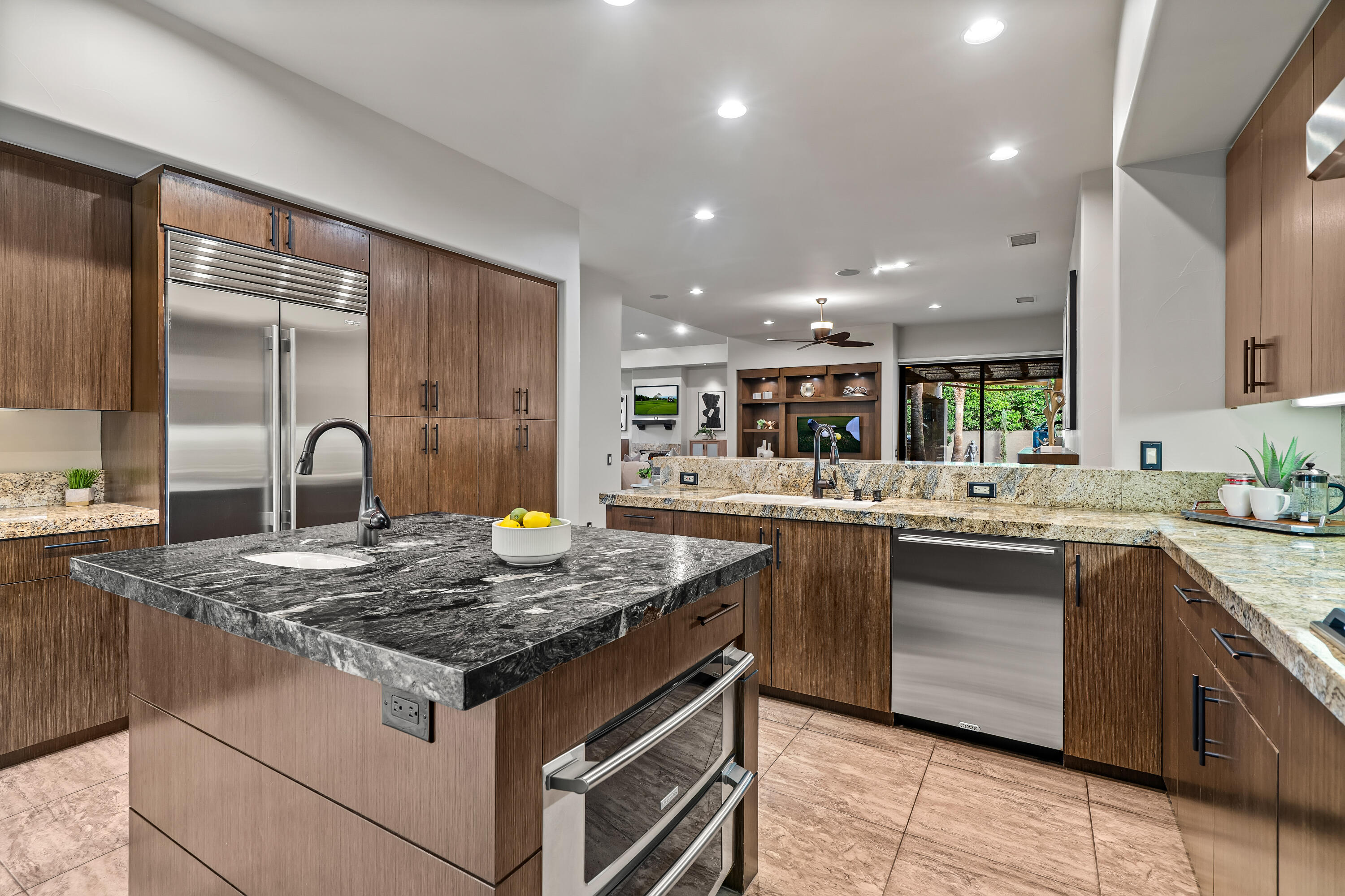 79200 Jack Rabbit Trail La Quinta, CA 92253 - Photo 37 of 76 a kitchen with kitchen island granite countertop a stove and a sink