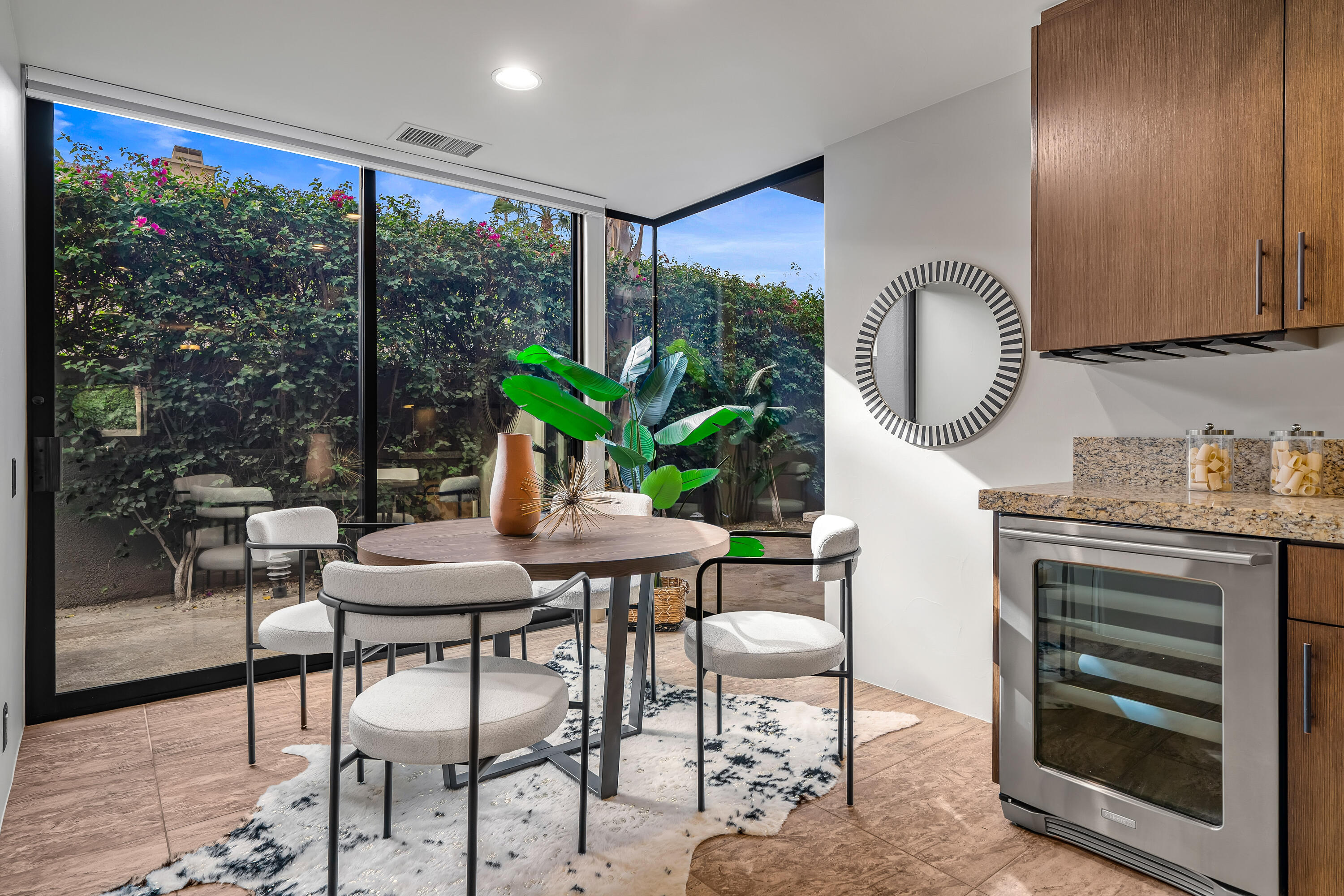 79200 Jack Rabbit Trail La Quinta, CA 92253 - Photo 39 of 76 a dining room with furniture and a floor to ceiling window