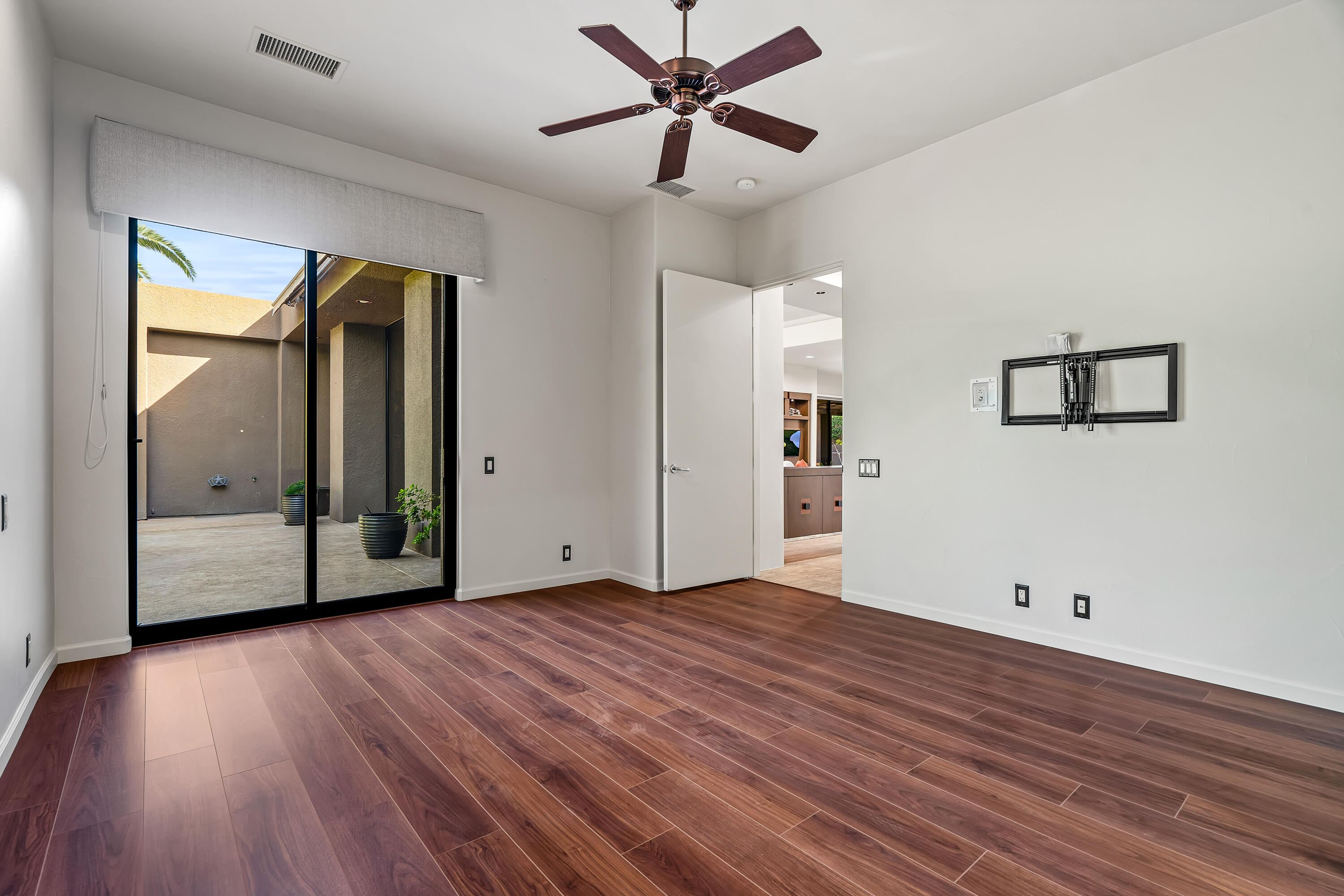 79200 Jack Rabbit Trail La Quinta, CA 92253 - Photo 42 of 76 a view of a livingroom with wooden floor and a ceiling fan