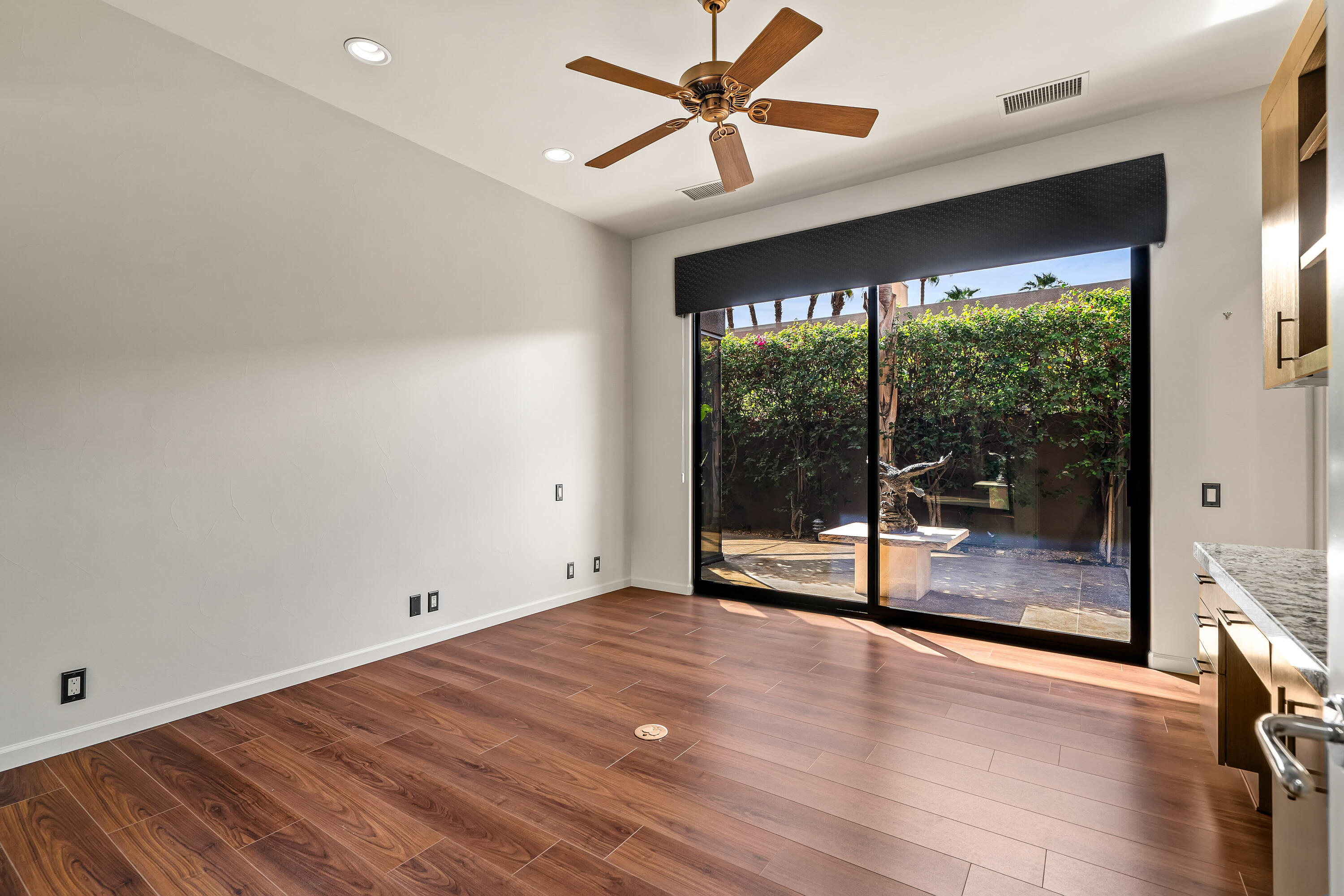 79200 Jack Rabbit Trail La Quinta, CA 92253 - Photo 47 of 76 a view of empty room with wooden floor and fan