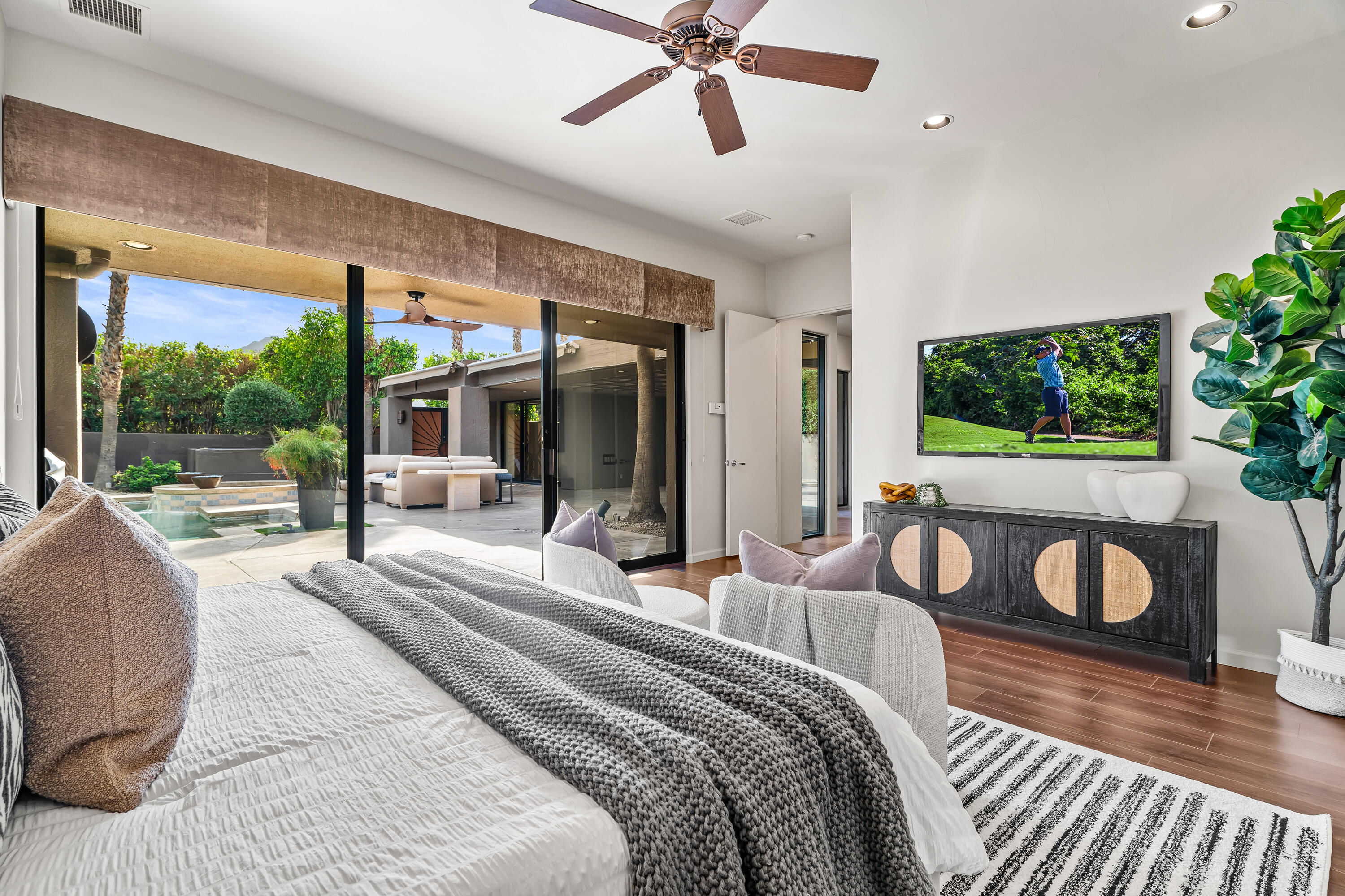 79200 Jack Rabbit Trail La Quinta, CA 92253 - Photo 61 of 76 a bedroom with a bed and a large window with garden view