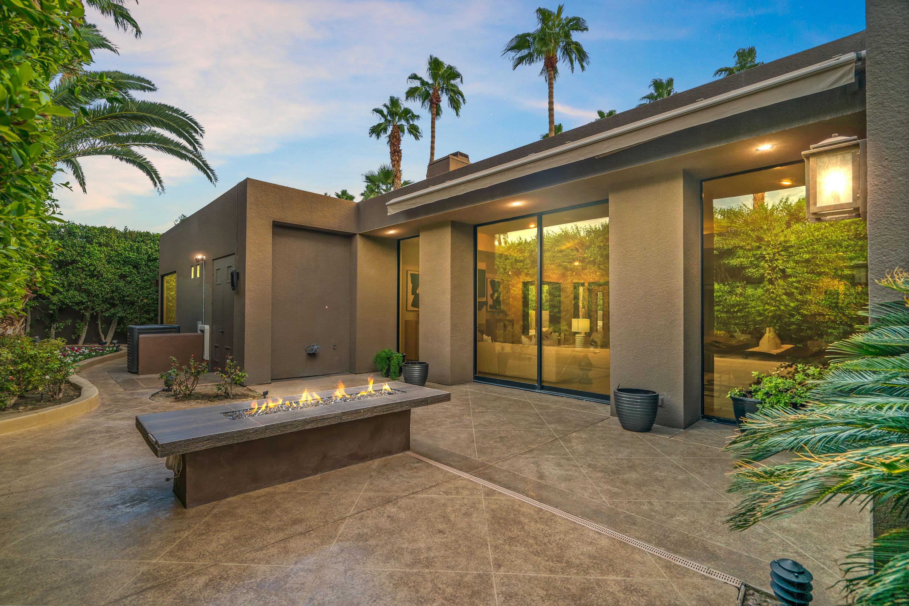 79200 Jack Rabbit Trail La Quinta, CA 92253 - Photo 74 of 76 a backyard of a house with fountain table and chairs