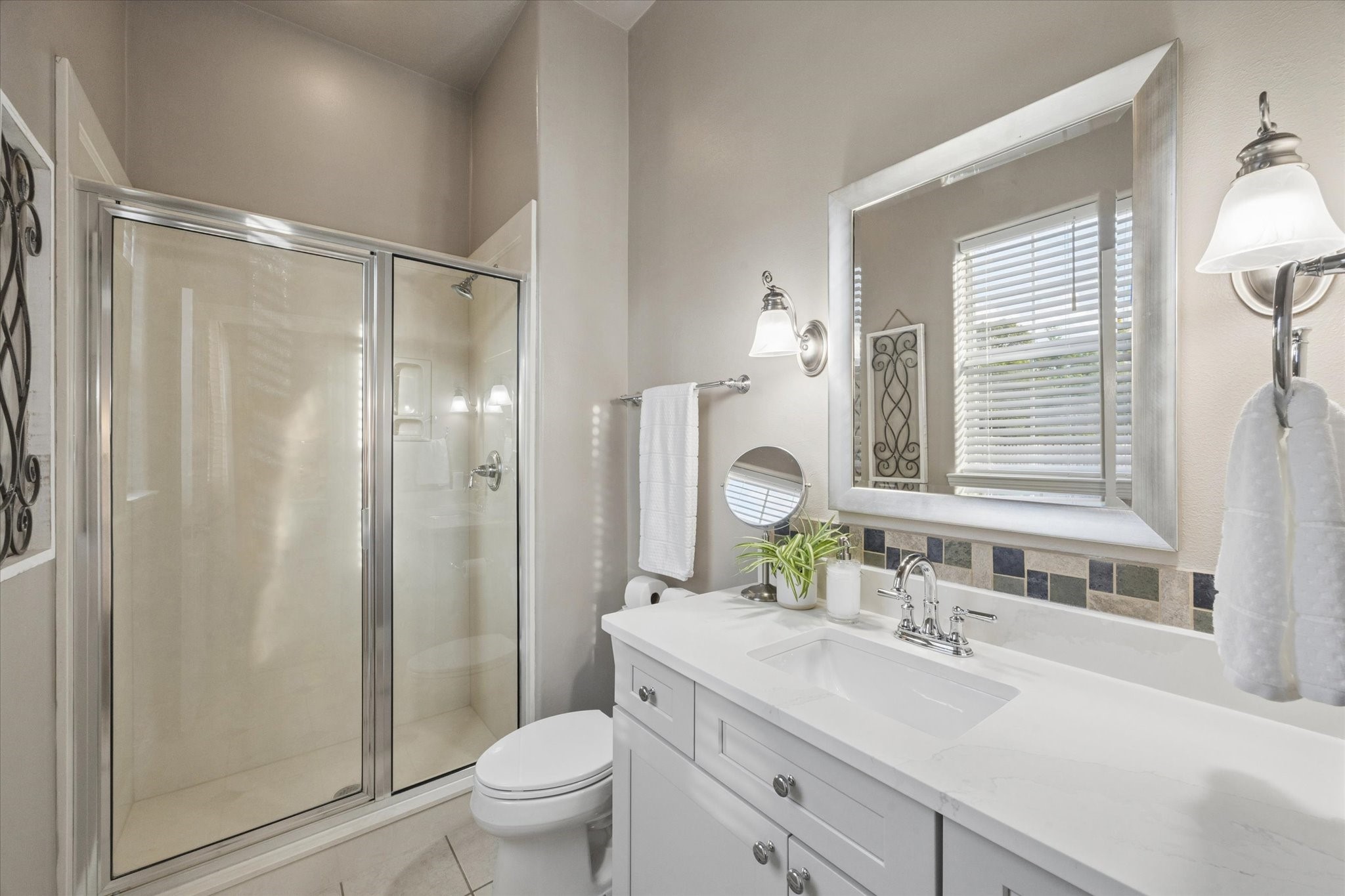 16519 Deerhaven Run Rosharon, TX 77583 - Photo 21 of 47 a bathroom with a sink toilet a mirror and shower