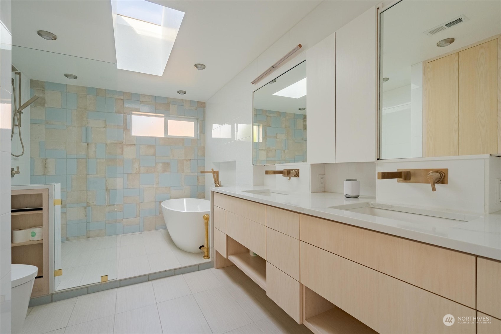 1239 Northwest 119th Street Seattle, WA 98177 - Photo 16 of 36 a spacious bathroom with a double vanity sink toilet and shower
