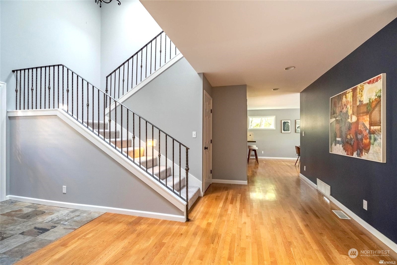 1239 Northwest 119th Street Seattle, WA 98177 - Photo 2 of 36 a view of a hallway with wooden floor and windows
