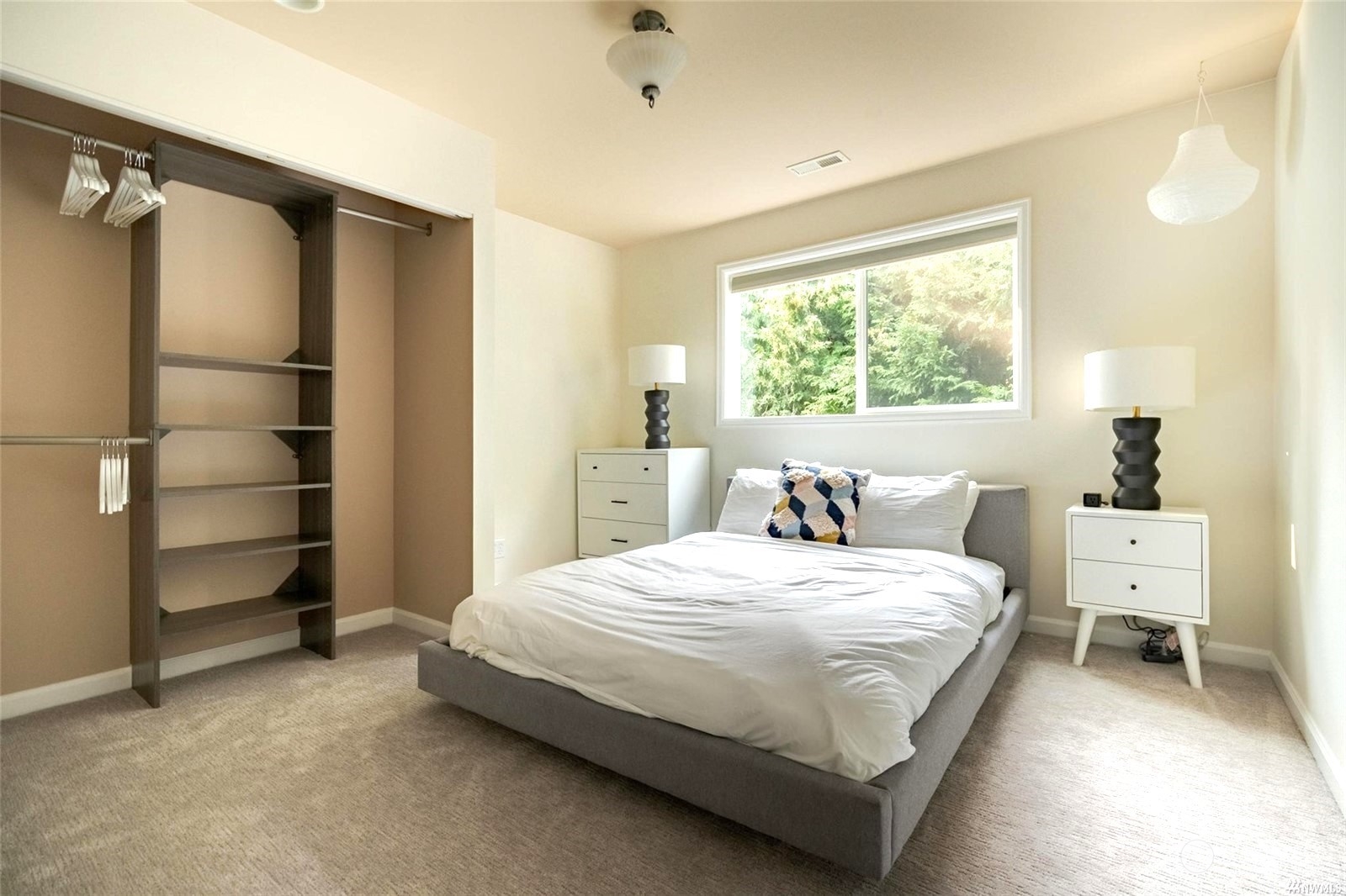 1239 Northwest 119th Street Seattle, WA 98177 - Photo 21 of 36 a bedroom with a bed and a window