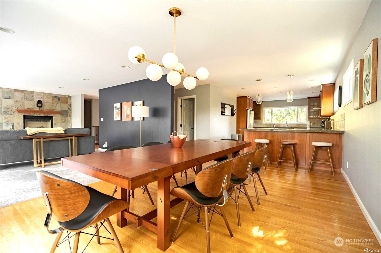 1239 Northwest 119th Street Seattle, WA 98177 - Photo 4 of 36 a view of a dining room with furniture and a chandelier