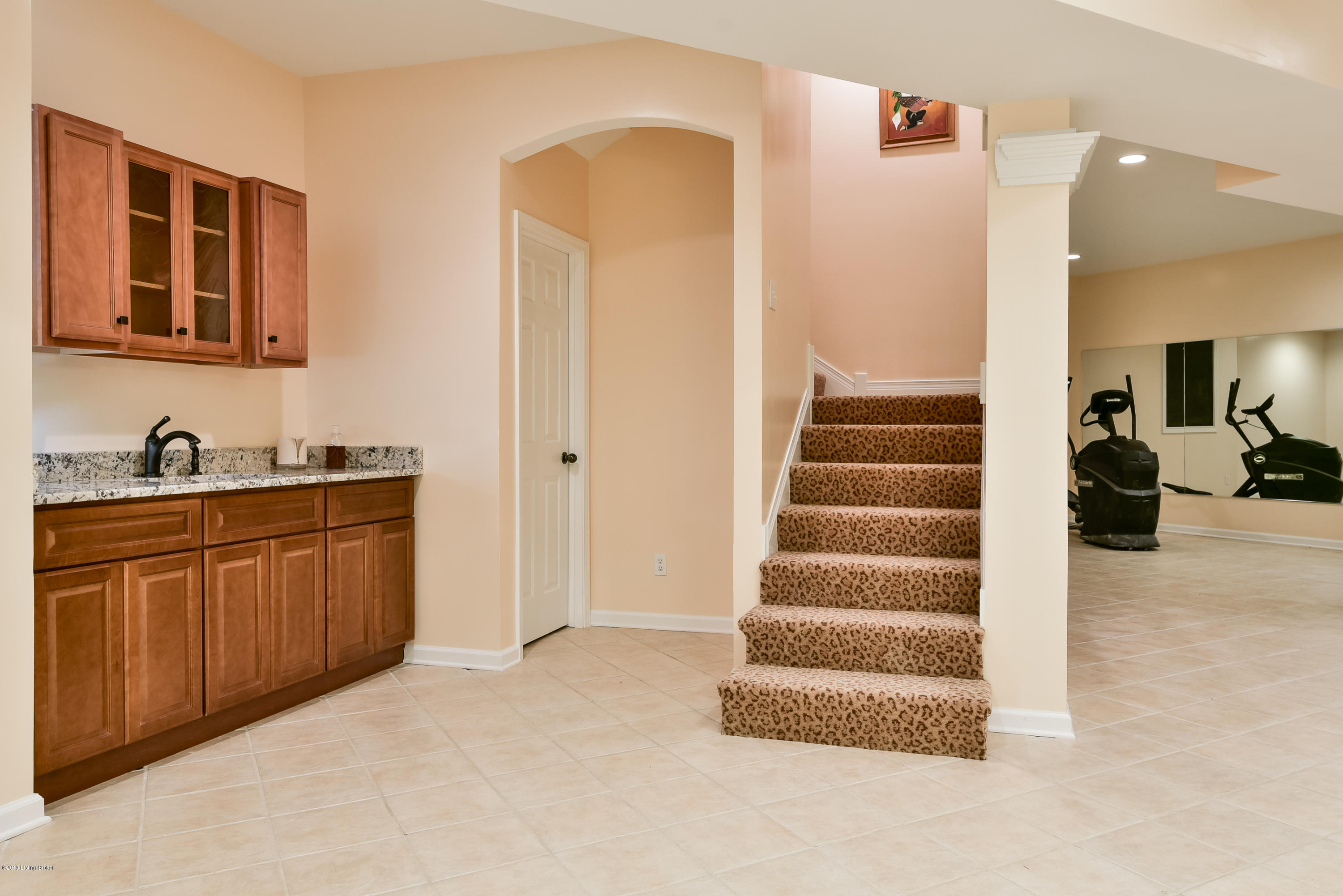 11511 Cedardale Road Anchorage, KY 40223 - Photo 24 of 99 Head down to the basement area and note the large tiled family room area with fireplace and surround sound - and the gym/play space/flex space.