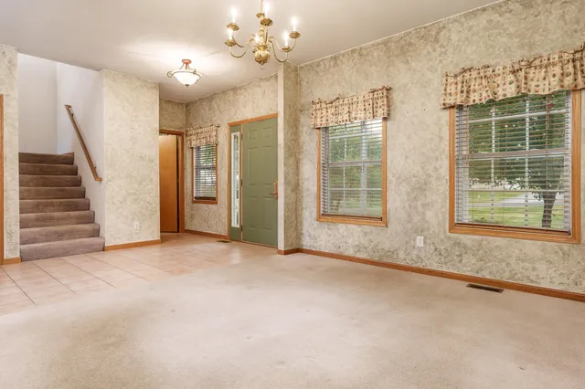 en empty room with a fireplace