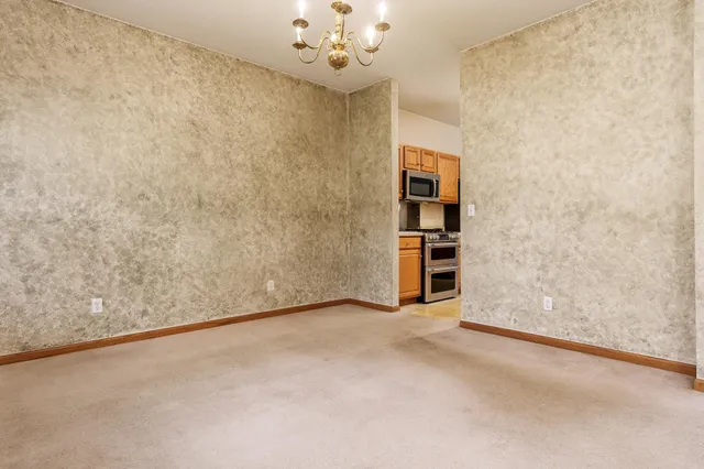 a kitchen with a sink window and cabinets