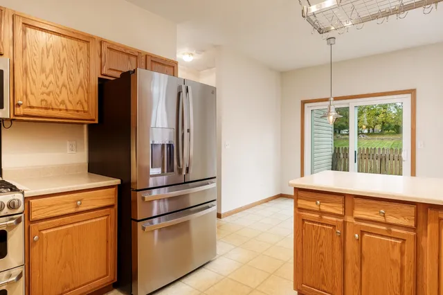 a kitchen with stainless steel appliances a refrigerator and a sink