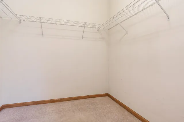 a bathroom with a double vanity sink a mirror and shower