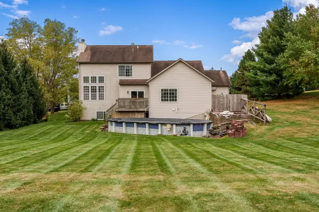 a view of a house with a yard porch and sitting area