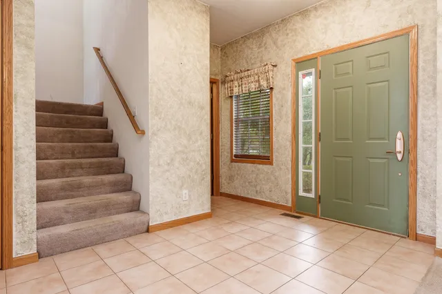 a view of an entryway with staircase