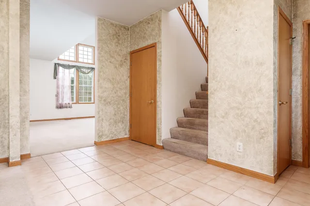 a view of an entryway with staircase