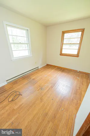 a view of an empty room and a window
