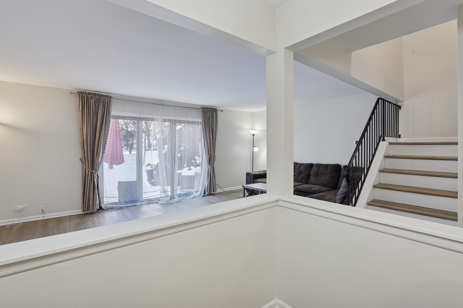 625 Breakers Point Schaumburg, IL 60194 - Photo 11 of 25 a view of an empty room with wooden floor and stairs