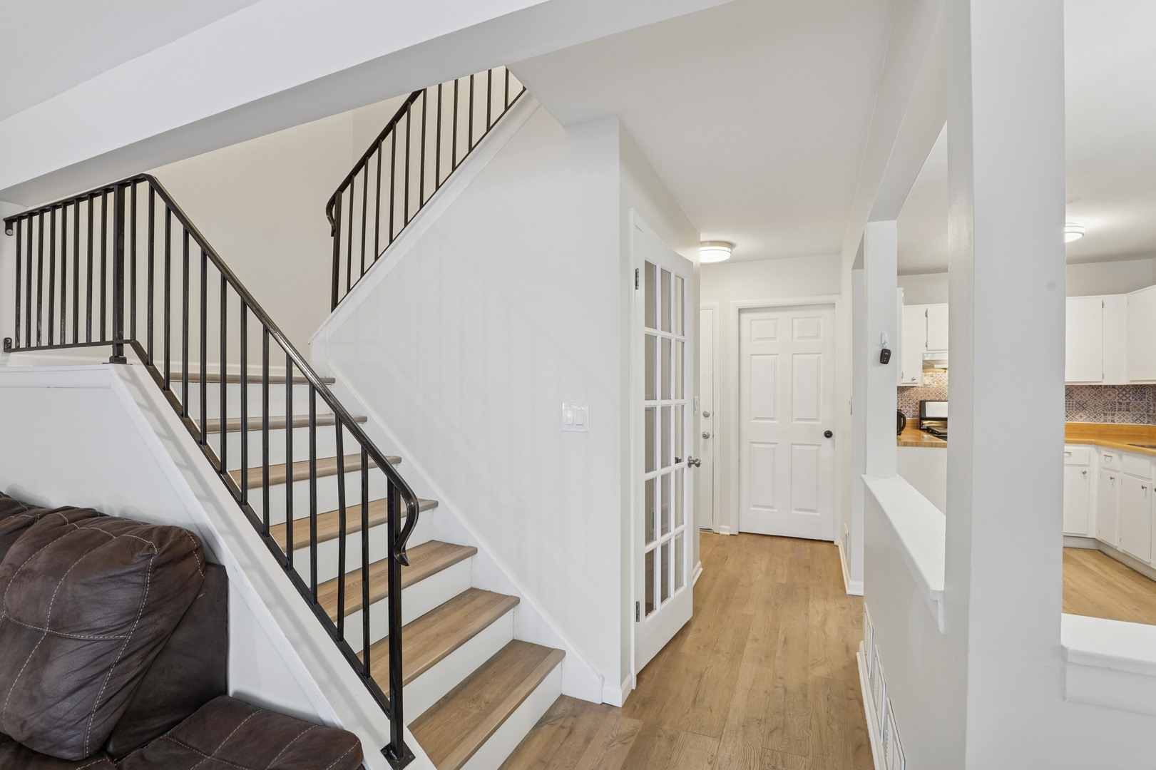 625 Breakers Point Schaumburg, IL 60194 - Photo 12 of 25 a view of a hallway with wooden floor and staircase