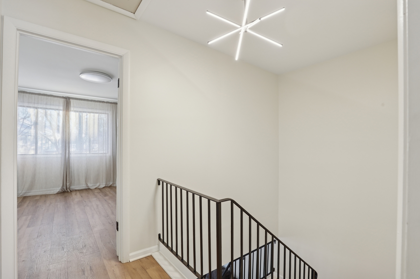 625 Breakers Point Schaumburg, IL 60194 - Photo 13 of 25 a view of a hallway with wooden floor and a window
