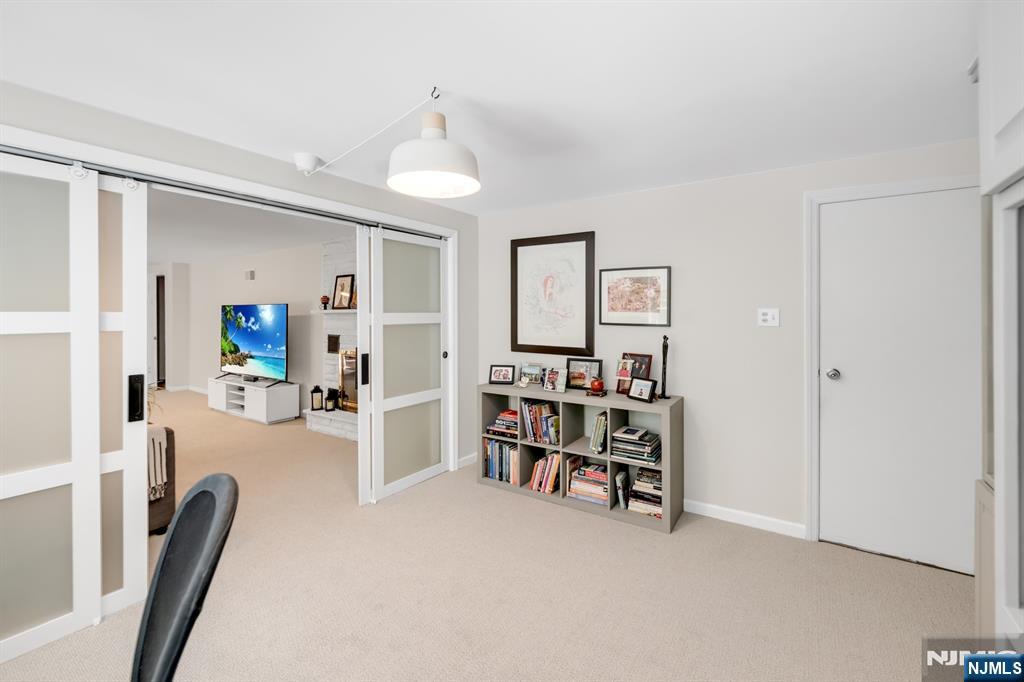 433 Piermont Road Cresskill, NJ 07626 - Photo 38 of 49 a view of a livingroom with furniture and a flat screen tv