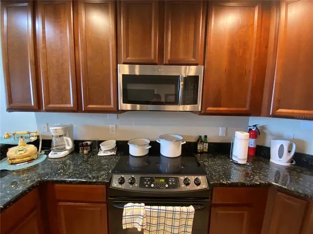 a view of living room with furniture and a chandelier