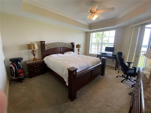 a bed room with a bed and a chair