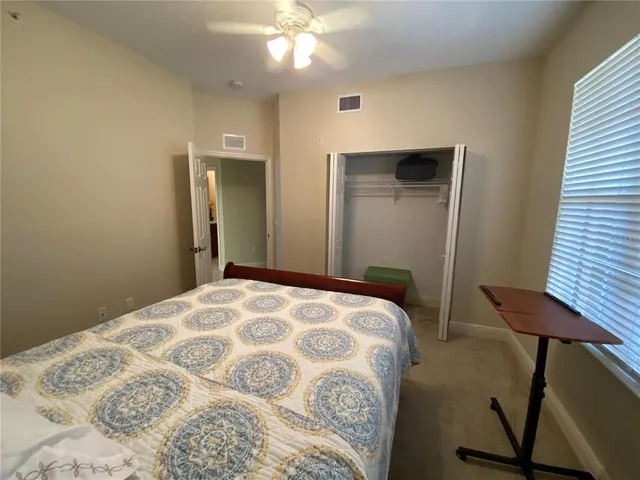a view of a hallway with wooden floor windows and entryway