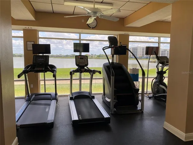 a view of a swimming pool with lawn chairs