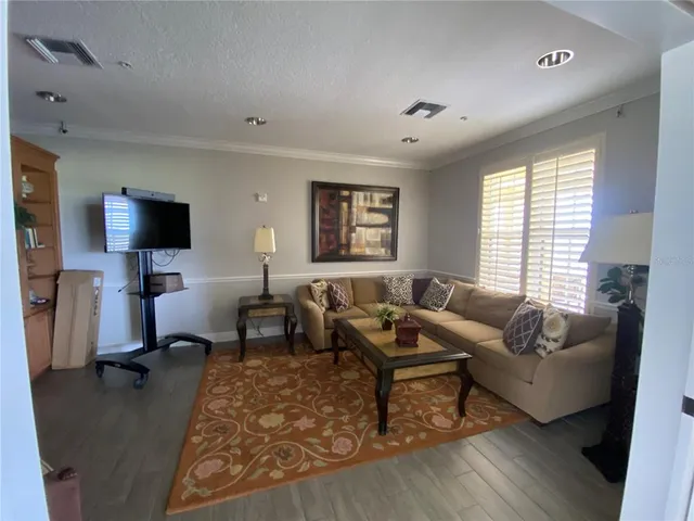 a view of balcony with wooden floor