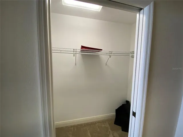 a bathroom with a tub a sink and mirror