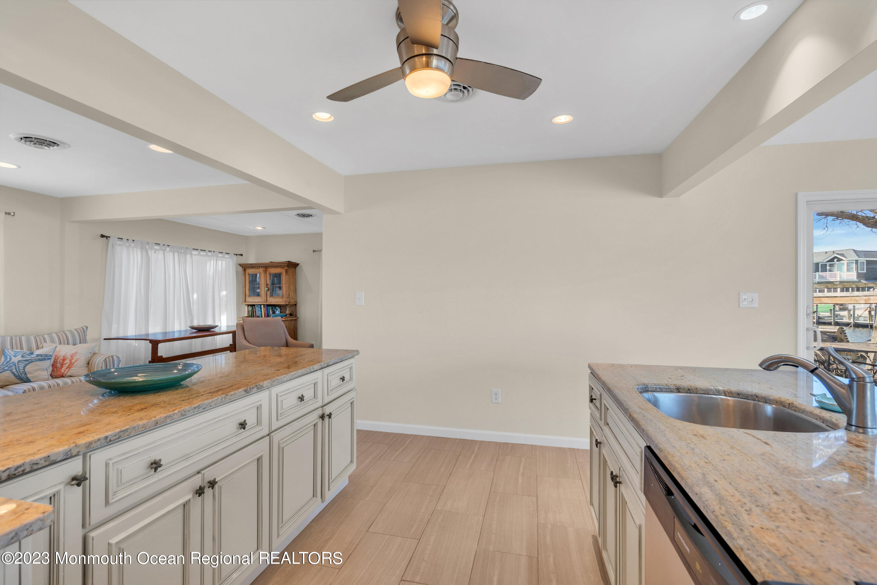 119 Caldwell Road Barnegat, NJ 08005 - Photo 11 of 51 a kitchen with sink cabinets and chandelier