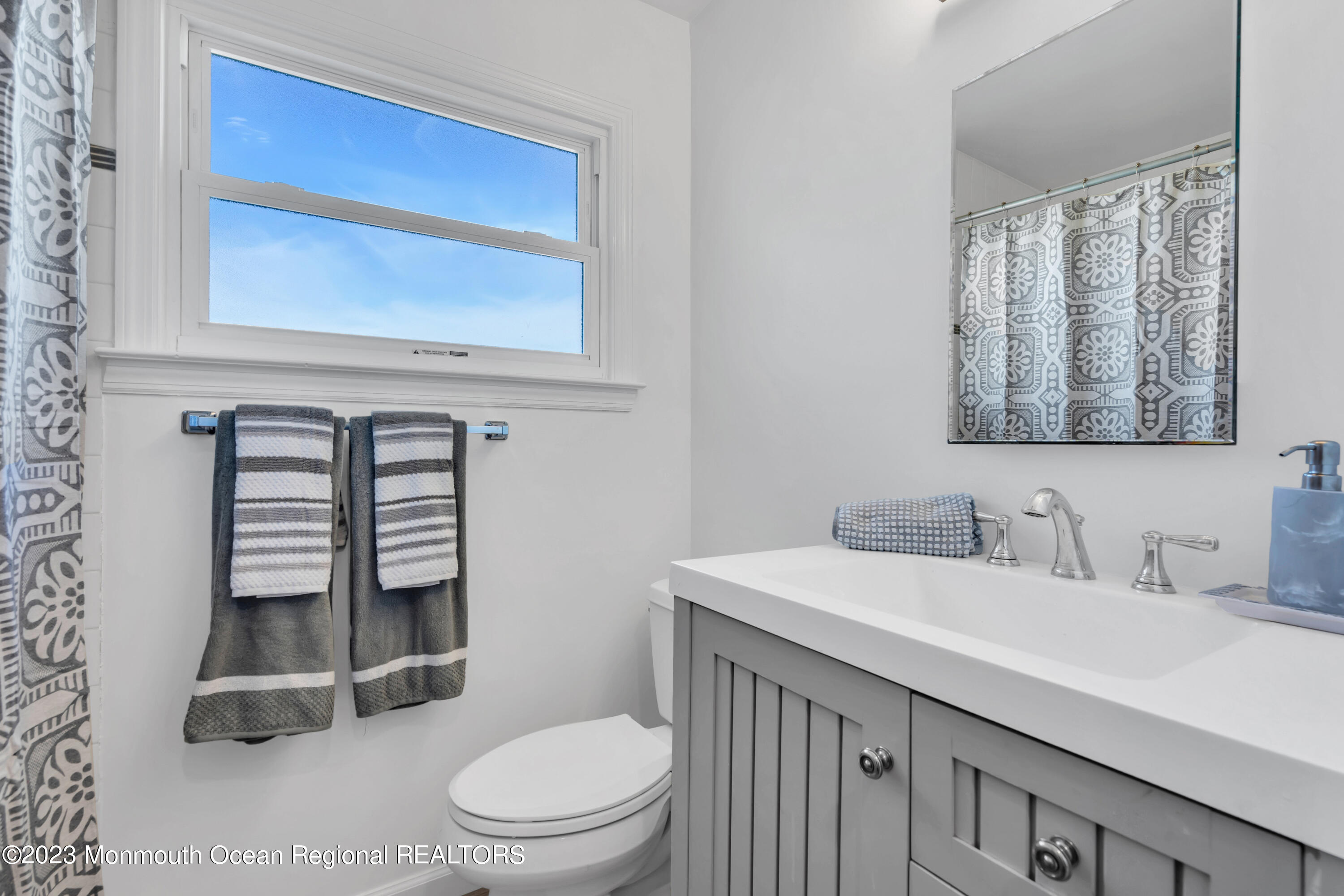 119 Caldwell Road Barnegat, NJ 08005 - Photo 24 of 51 a bathroom with a toilet a sink and mirror